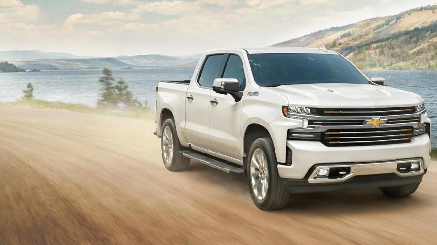 The 2023 Chevy Silverado driving on a dirt road