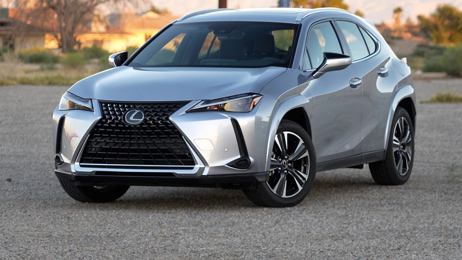 Front 3/4 view of silver 2023 Lexus UX 250h hybrid compact SUV during fuel economy test