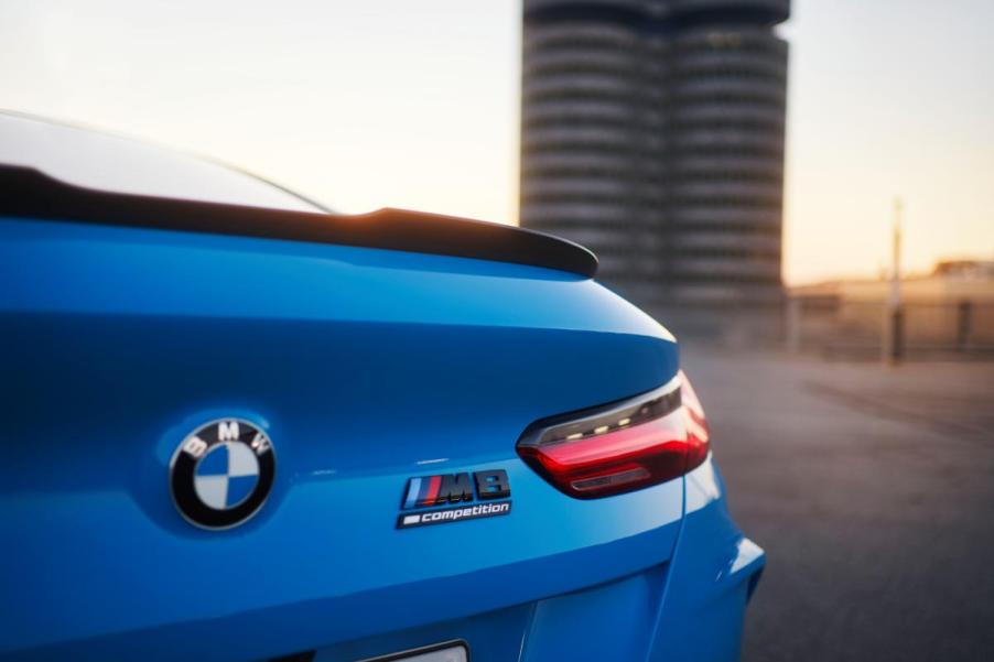 A blue 2023 BMW M8 Competition on display.