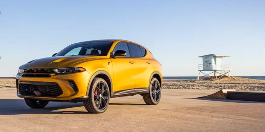 A yellow 2024 Dodge Hornet small SUV is parked.