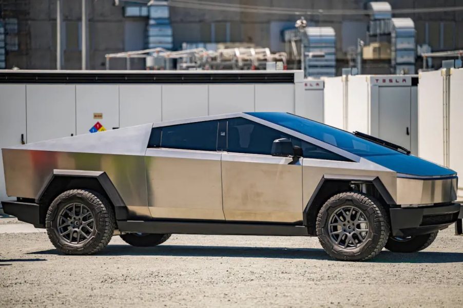 Side view of the 2024 Tesla Cybertruck electric pickup truck parked at the factory.