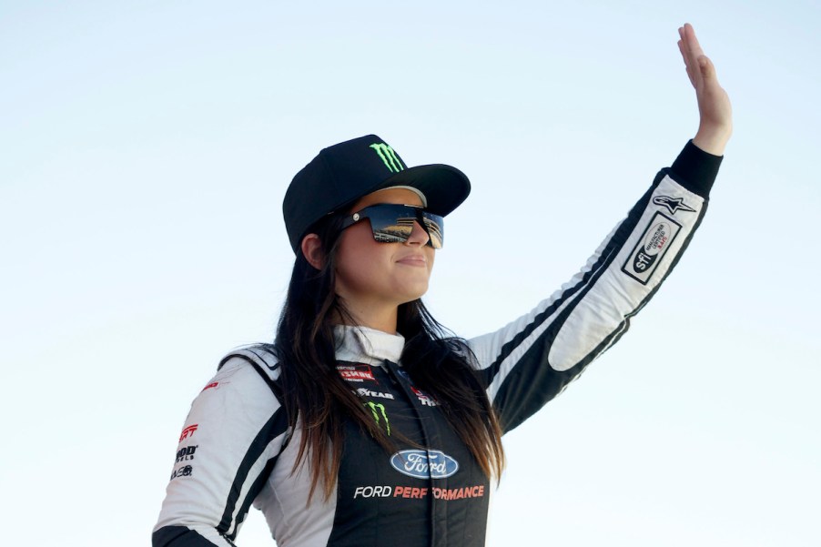 Hailie Deegan waves to fans.