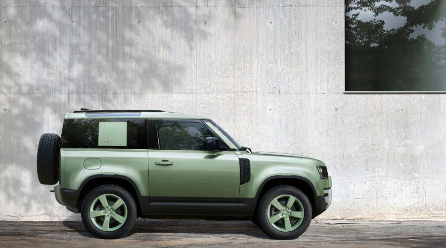 A green Land Rover Defender 90, smaller than the 110, shows off the model's shorter wheelbase.