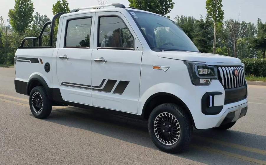 A white ChangLiEV mini electric truck parked on a road