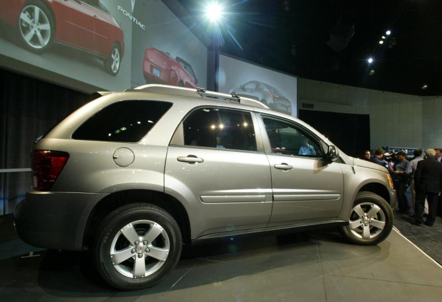 A Pontiac Torrent on display during an auto show.