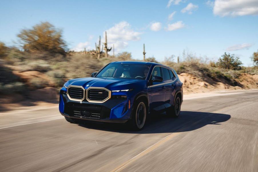 The first-ever BMW XM luxury plug-in hybrid electric vehicle SUV model in Marina Bay Blue Metallic