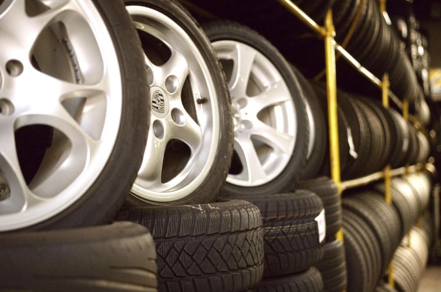 Racks and stacks of car tires in a vehicle repair shop in Germany