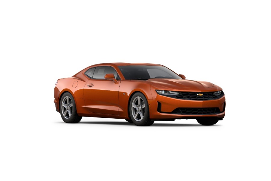 An orange 2024 Chevrolet Camaro on display.