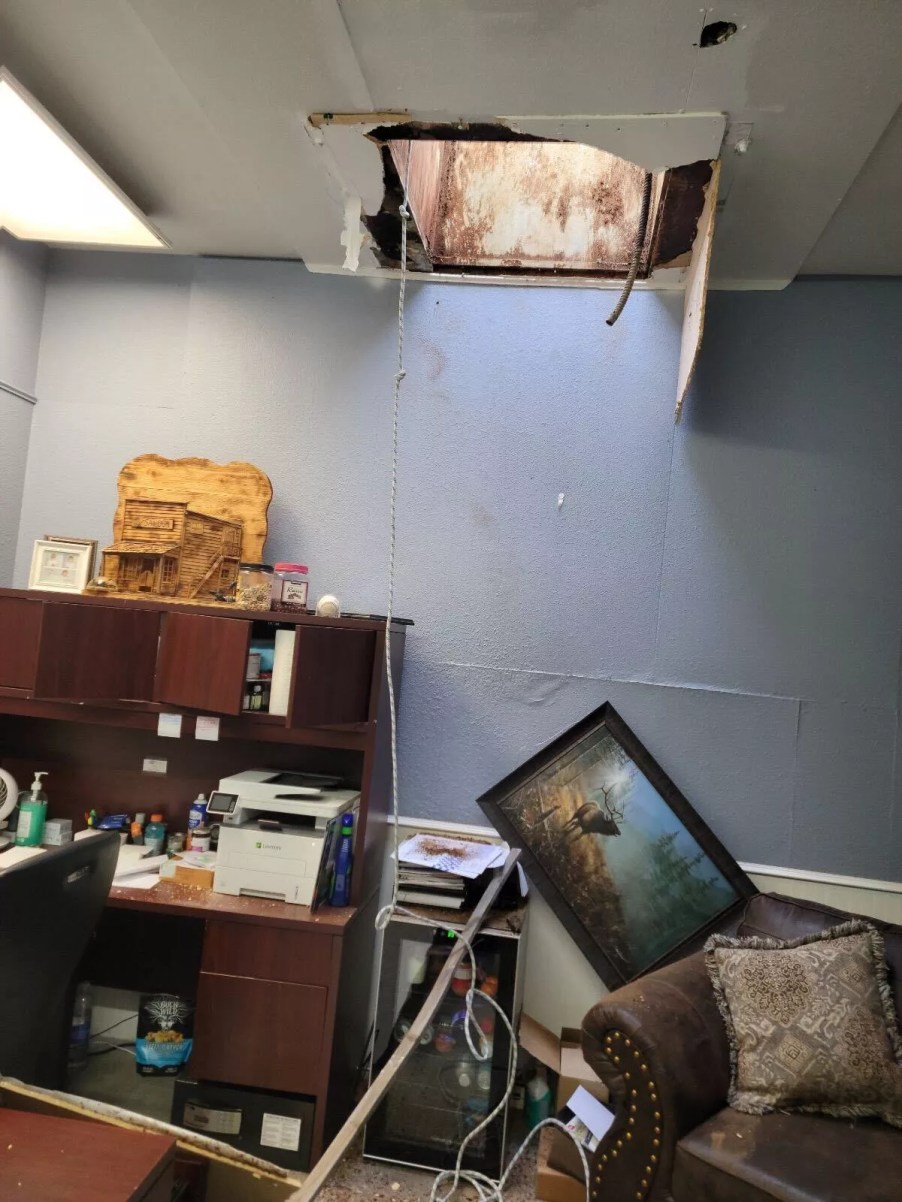 A hole cut into a car dealership office ceiling shows how far thieves are willing to go to steal cars