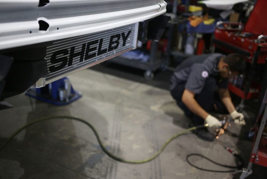 A Shelby tech works on a Ford Mustang before the company focuses on the S650.