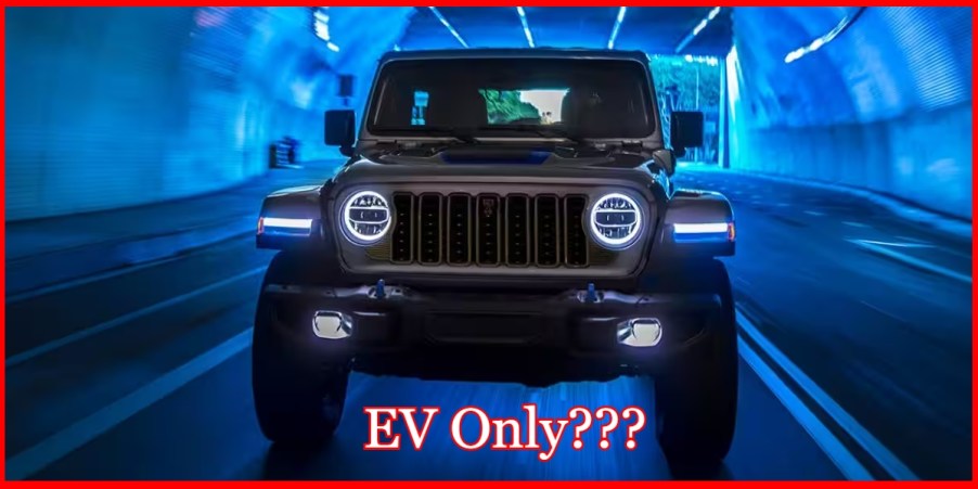 A brown Jeep Wrangler 4xe plug-in hybrid in a tunnel.