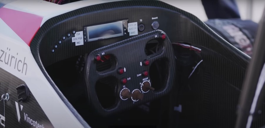 The carbon fiber steering wheel and cockpit of the 0-60 record breaking Mythen student formula car.