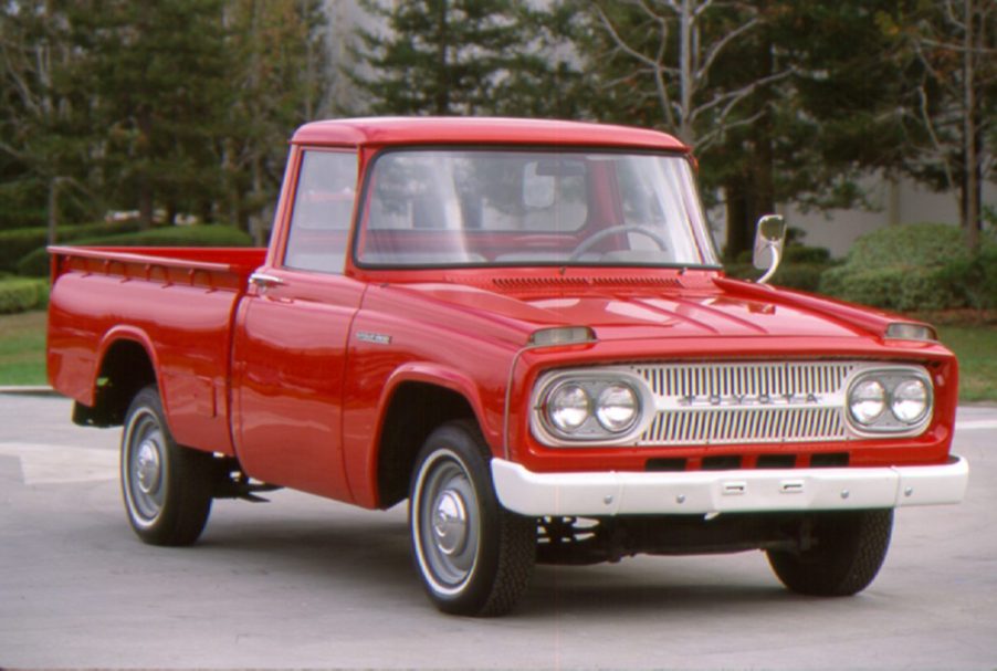 A red Toyota Stout pickup truck on display.