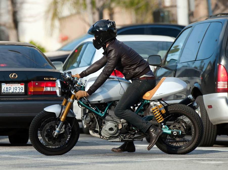 A-list celebrity motorcycle rider Ryan Reynolds straddles his Paul Smart Ducati in LA.