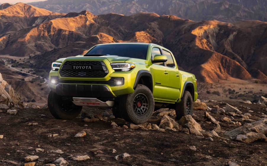 The 2023 Toyota Tacoma climbing over rocks