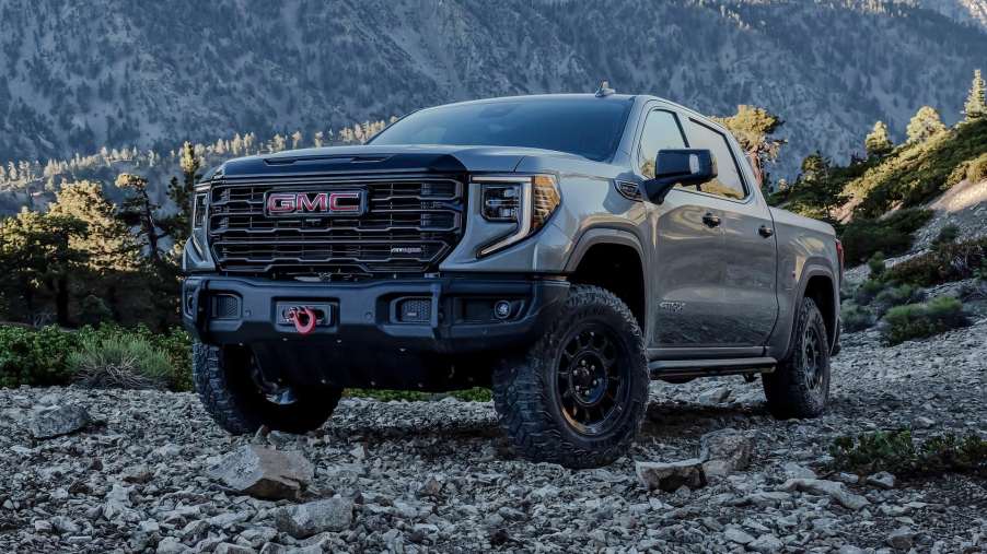 The 2024 GMC Sierra parked in gravel