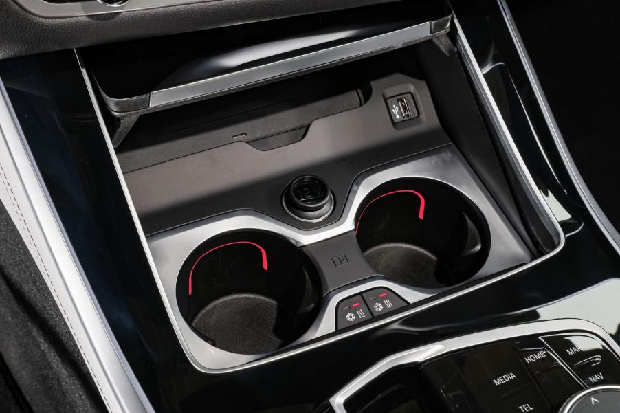 A BMW X5 shows off its heated cup holders.