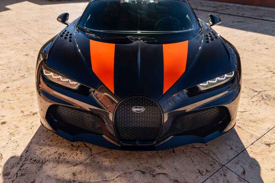 A black and orange 2022 Bugatti Super Sport 300+ the world's fastest production car front view