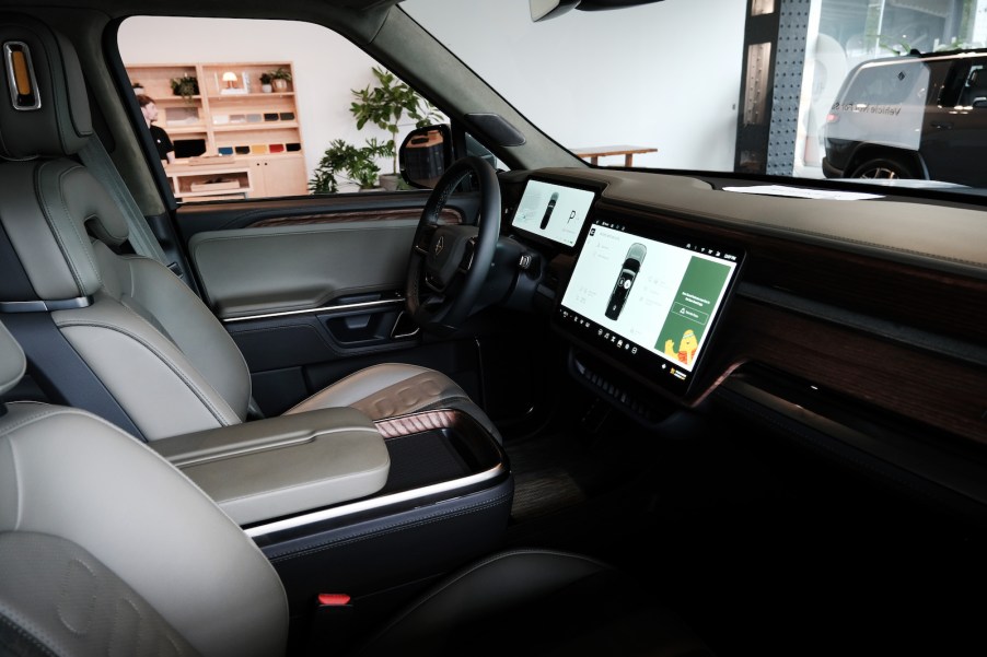 White leather interior of a Rivian electric pickup truck.