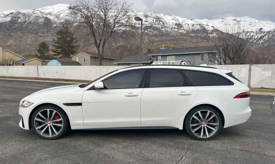 Side view of a white Jaguar station wagon.