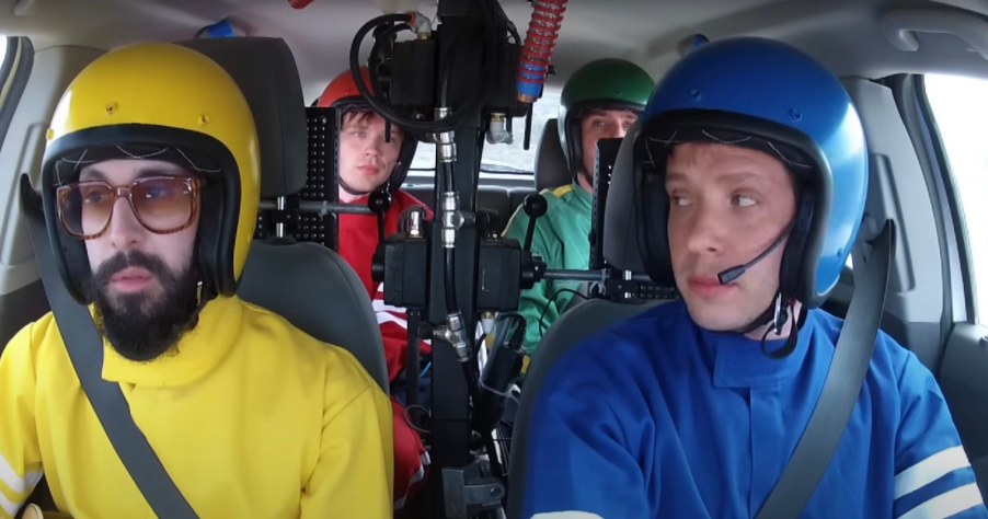 The members of OK Go in their Chevrolet Sonic filming the Needing/Getting music video.