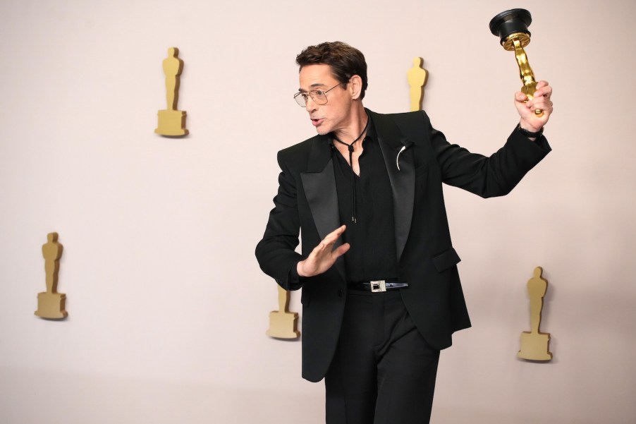 Actor Robert Downey Jr. posing with his oscar, 2024