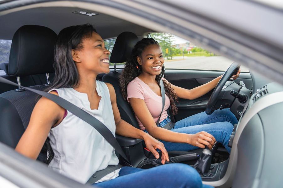 Teenage driver getting lessons from her mother