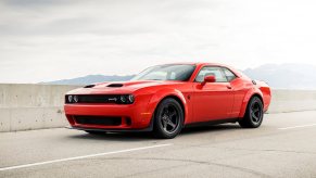 A red 2020 Dodge Challenger Super Stock parked on the highway left front angle view