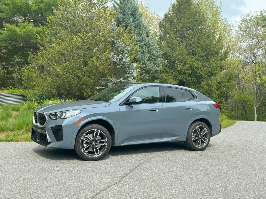 The 2024 BMW X2 parked near foliage