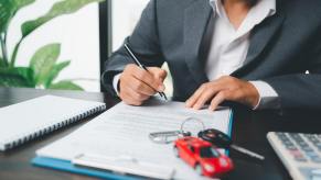 An insurance agent works on an act of God car insurance claim.