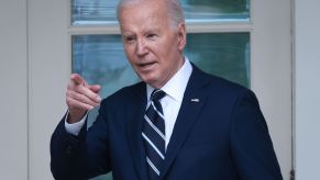 President Joe Biden gestures at an event after announcing tariffs on Chinese electric cars.