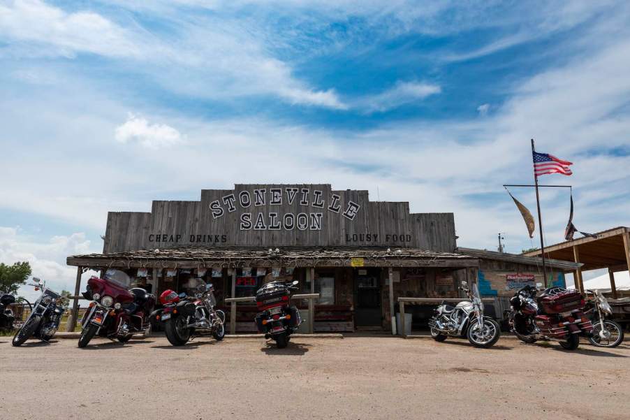 Row of Harley Davidsons parked in front of a saloon in Montana