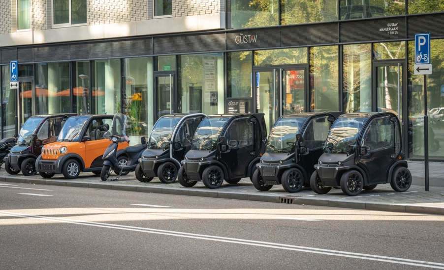 A row of microcars in Amsterdam.