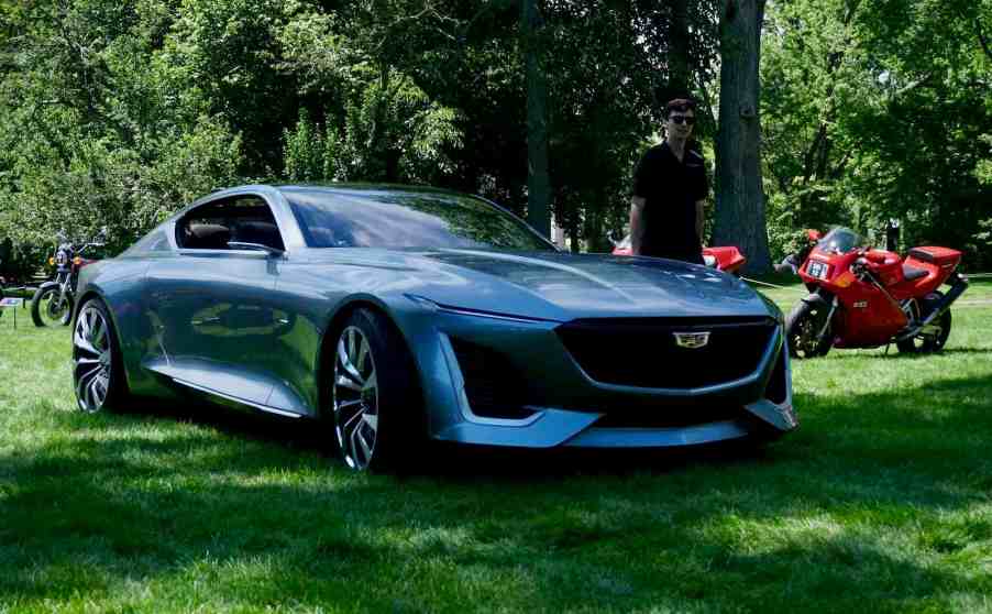 Front of a Cadillac Expressive concept coupe parked in a field at a car show