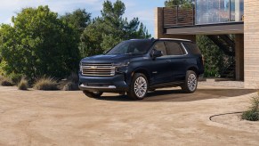 The 2024 Chevrolet Tahoe parked near a home