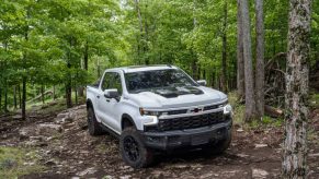 The 2024 Chevy Silverado off-roading in the woods