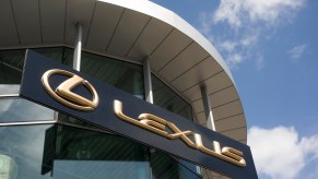 Golden Lexus sign above a dealership