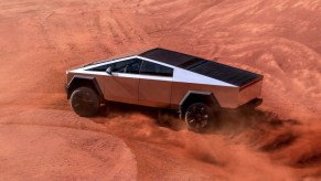 The Tesla Cybertruck kicking up dirt