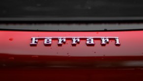 Ferrari lettering on a red car the Ferrari EV is rumored to start at over half a million dollars