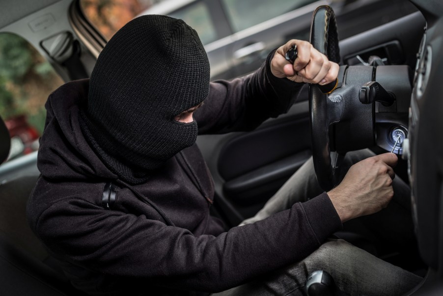 A man stealing a car