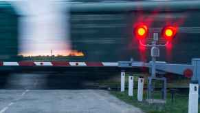 Railroad crossing train moving fast