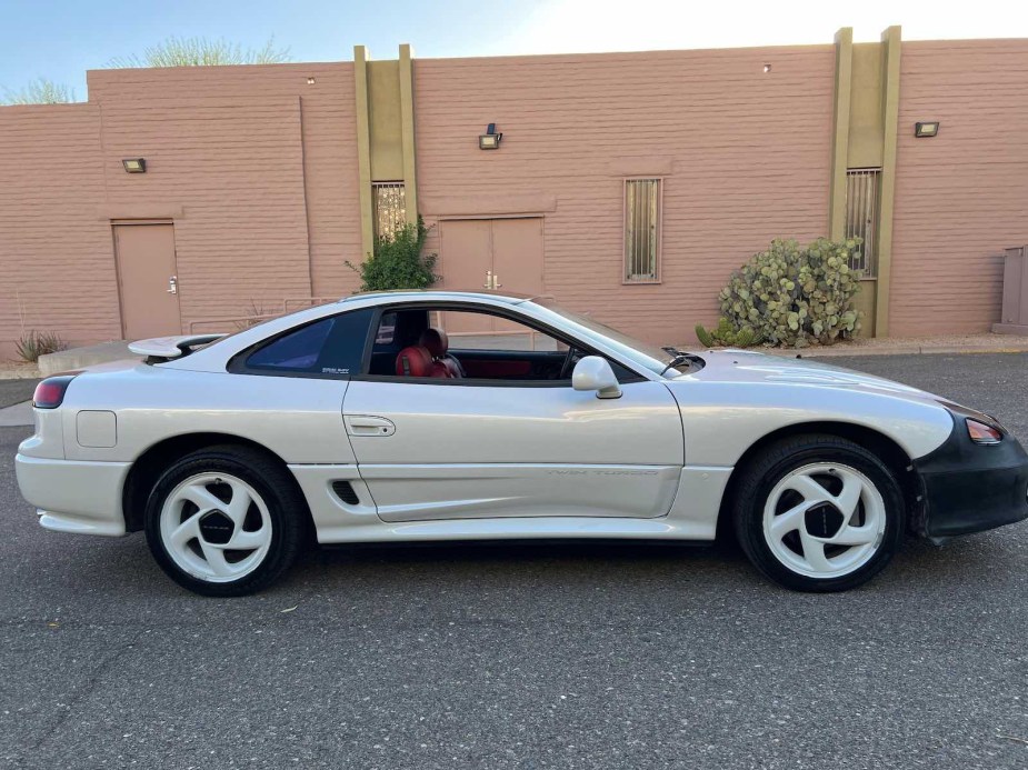 Side of a white Dodge Stealth classic sports car coupe.