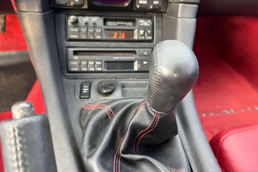 The stick shift lever in a 1992 Dodge Stealth.