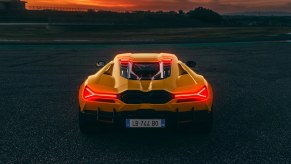 A bright-yellow 2024 Lamborghini Revuelto shows off its rear end styling without BAR mode.