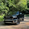 The 2025 Ram 1500 H.O off-roading in the woods