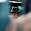 Brad Pitt in a race car filming F1 at the British Grand Prix.