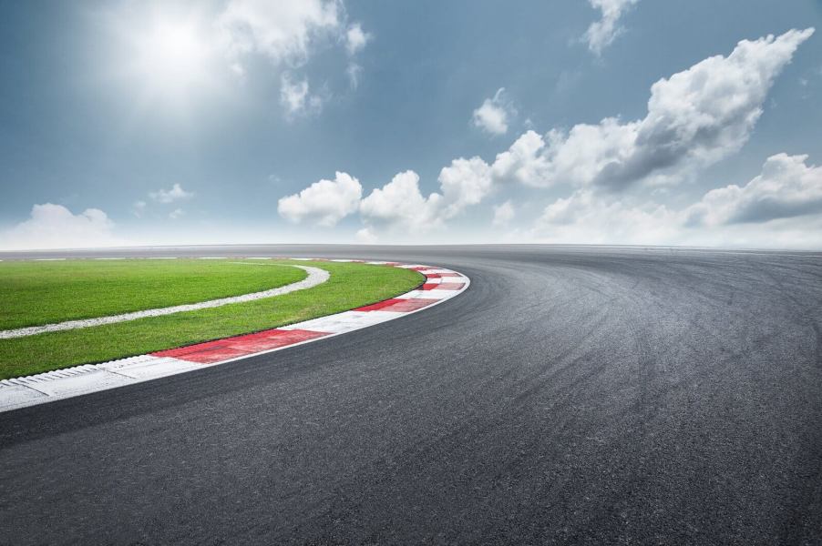 A race track corner beckons drivers to take on a track day.