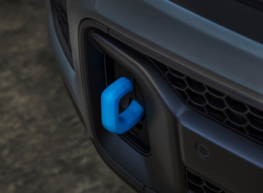 Blue tow hook on a plug-in-hybrid Jeep SUV