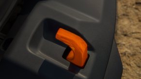 Reddish orange tow hook sticking out of the bumper of a Jeep Gladiator Mojave 4x4