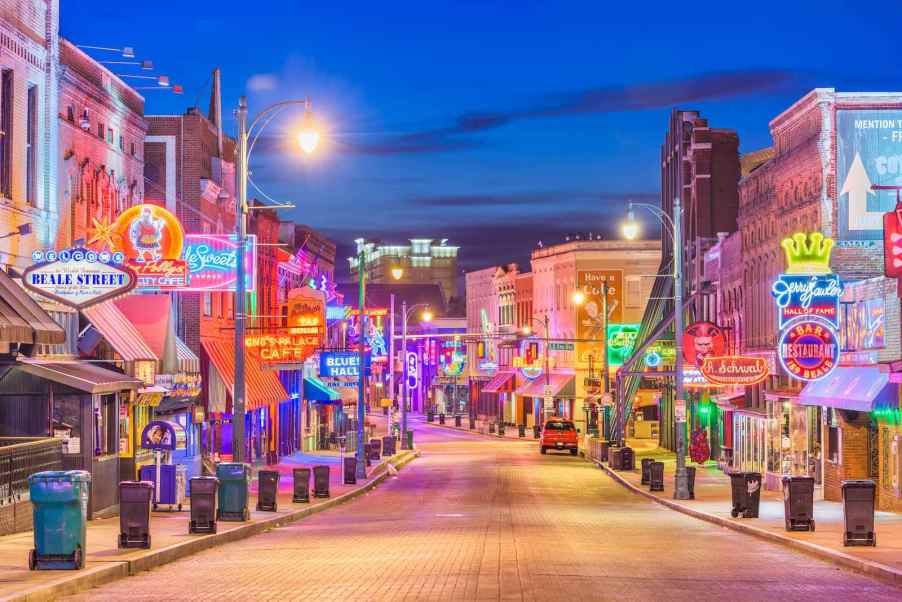 The Blues clubs lining Beale Street in Memphis, Tennessee at twilight.